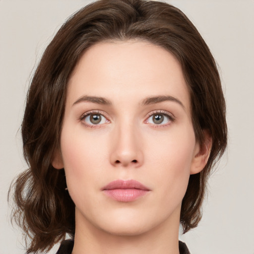 Neutral white young-adult female with medium  brown hair and green eyes