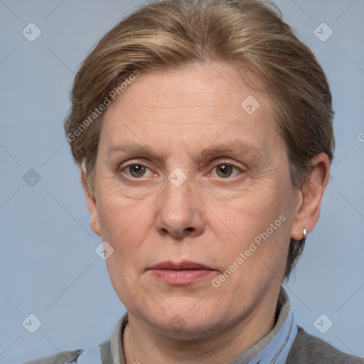 Joyful white adult female with short  brown hair and grey eyes