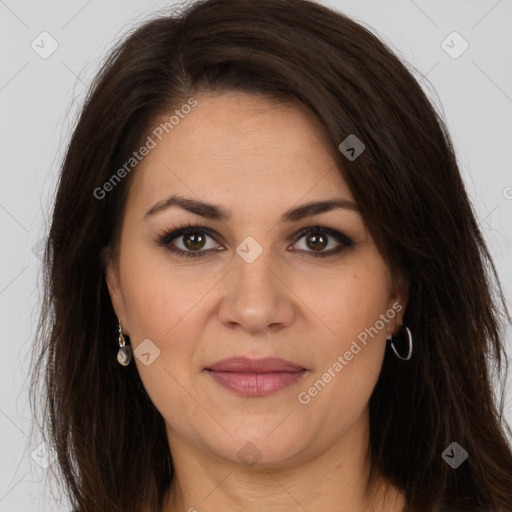 Joyful white adult female with long  brown hair and brown eyes