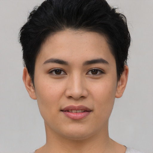 Joyful asian young-adult female with short  brown hair and brown eyes