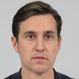 Neutral white adult male with short  brown hair and brown eyes