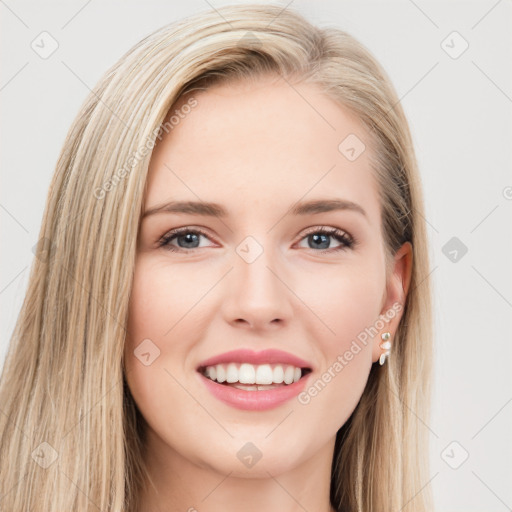 Joyful white young-adult female with long  brown hair and blue eyes