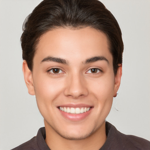 Joyful white young-adult female with short  brown hair and brown eyes