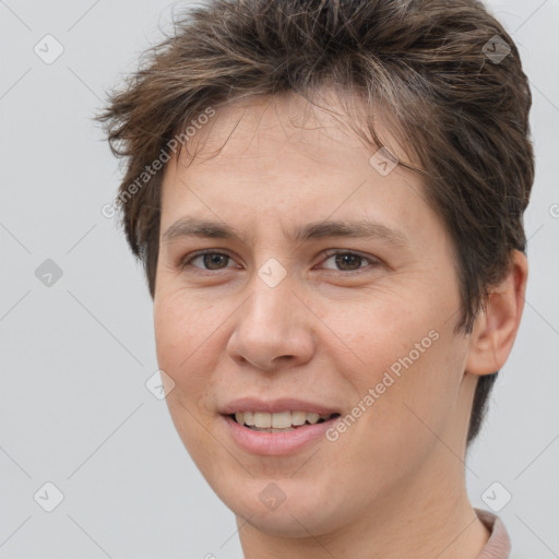 Joyful white young-adult female with short  brown hair and brown eyes