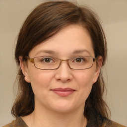 Joyful white adult female with medium  brown hair and brown eyes