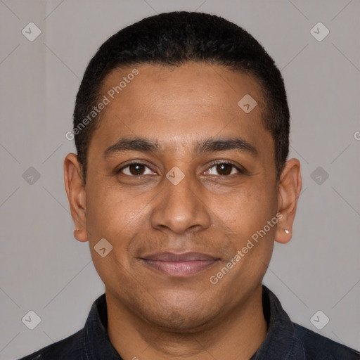 Joyful latino young-adult male with short  brown hair and brown eyes