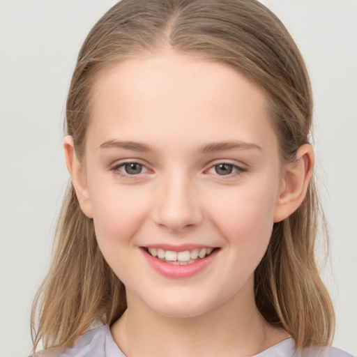 Joyful white child female with medium  brown hair and brown eyes