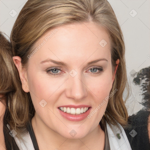 Joyful white young-adult female with medium  brown hair and blue eyes