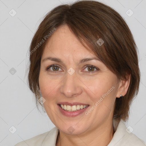 Joyful white adult female with medium  brown hair and brown eyes