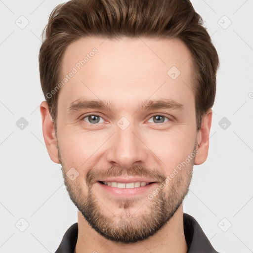 Joyful white young-adult male with short  brown hair and grey eyes