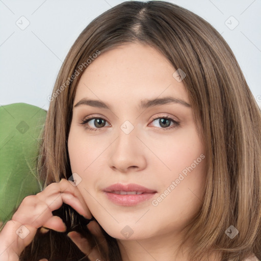 Neutral white young-adult female with long  brown hair and brown eyes