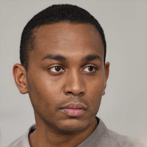 Neutral black young-adult male with short  black hair and brown eyes