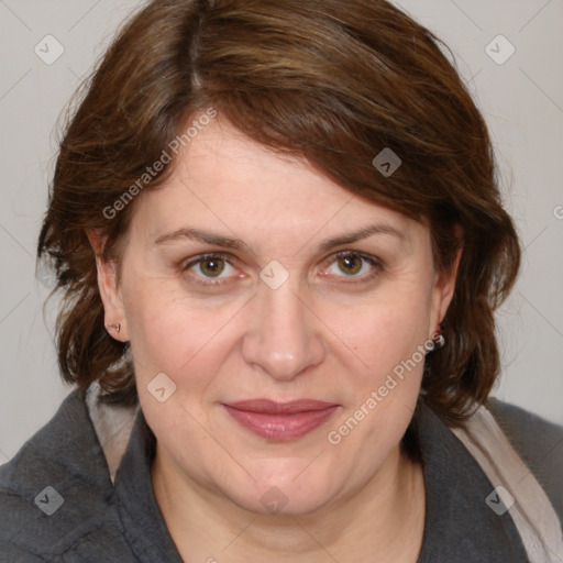 Joyful white adult female with medium  brown hair and blue eyes