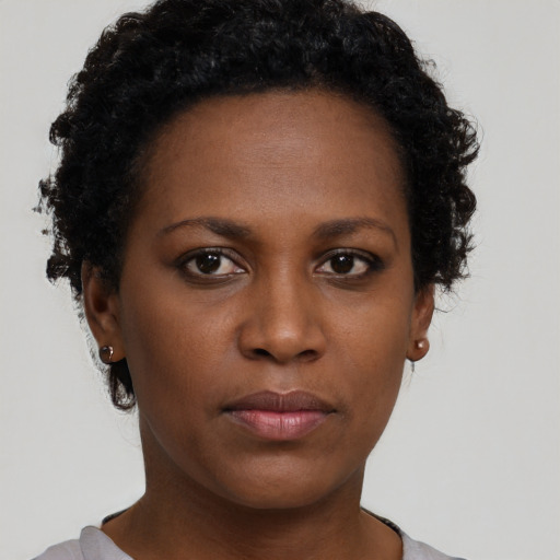 Neutral black young-adult female with short  brown hair and brown eyes