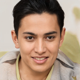 Joyful latino young-adult male with short  brown hair and brown eyes