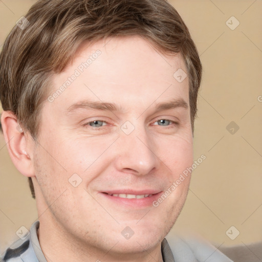 Joyful white adult male with short  brown hair and grey eyes