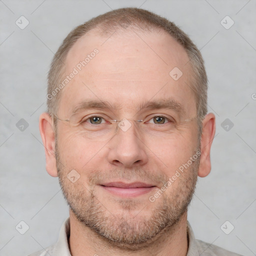 Joyful white adult male with short  brown hair and grey eyes