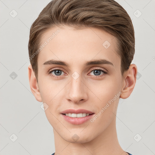 Joyful white young-adult male with short  brown hair and grey eyes