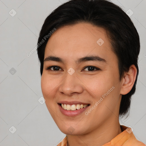 Joyful asian young-adult female with medium  brown hair and brown eyes