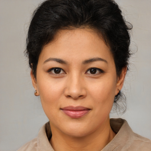 Joyful asian young-adult female with short  brown hair and brown eyes