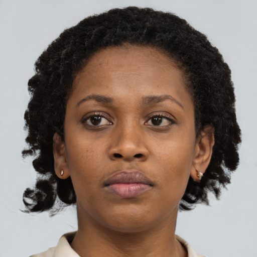 Neutral black young-adult female with short  brown hair and brown eyes
