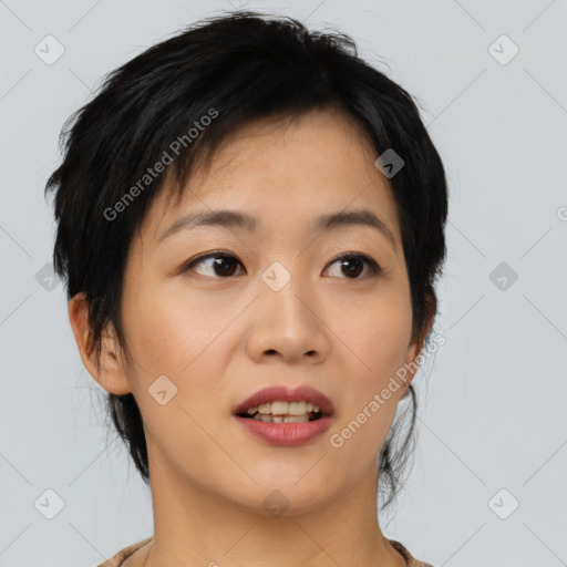 Joyful asian young-adult female with medium  black hair and brown eyes