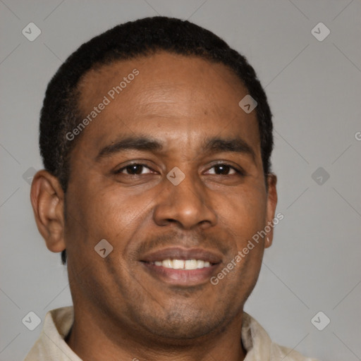 Joyful latino young-adult male with short  brown hair and brown eyes