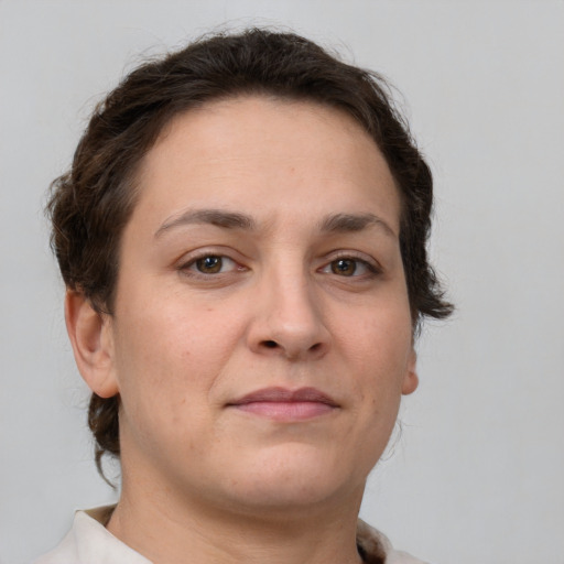 Neutral white young-adult female with medium  brown hair and brown eyes