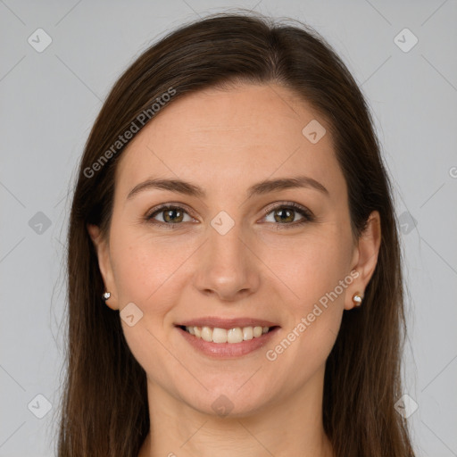 Joyful white young-adult female with long  brown hair and brown eyes