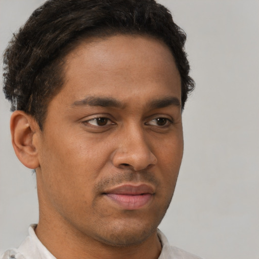 Neutral black young-adult male with short  brown hair and brown eyes