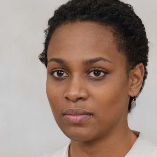 Neutral black young-adult female with short  black hair and brown eyes