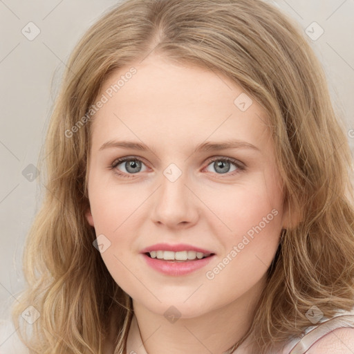 Joyful white young-adult female with long  brown hair and blue eyes