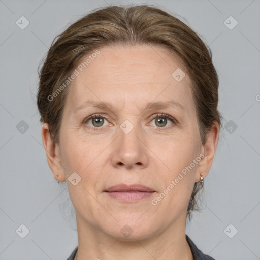 Joyful white adult female with medium  brown hair and grey eyes