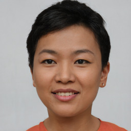 Joyful asian young-adult female with short  brown hair and brown eyes