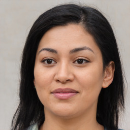 Joyful asian young-adult female with long  brown hair and brown eyes