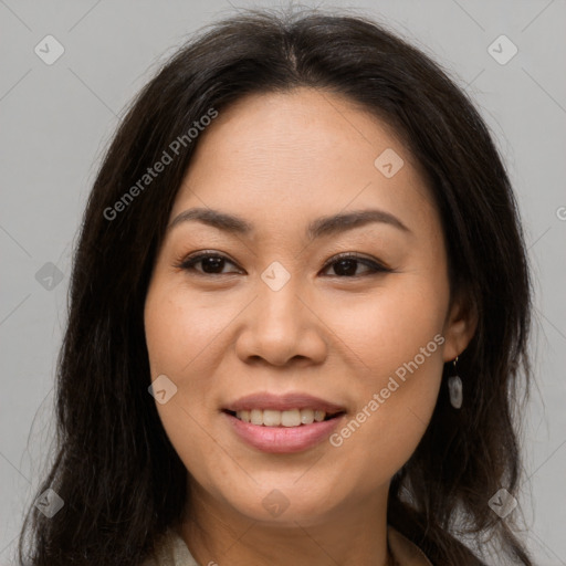 Joyful asian young-adult female with long  brown hair and brown eyes