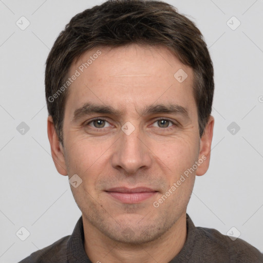 Joyful white adult male with short  brown hair and brown eyes