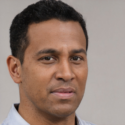 Neutral black adult male with short  brown hair and brown eyes