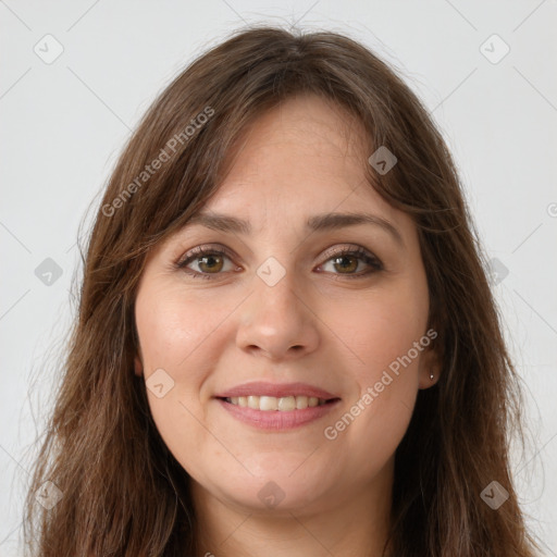 Joyful white young-adult female with long  brown hair and green eyes