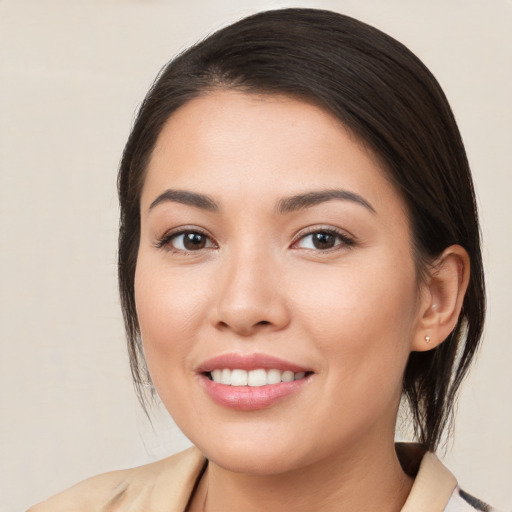 Joyful white young-adult female with medium  brown hair and brown eyes