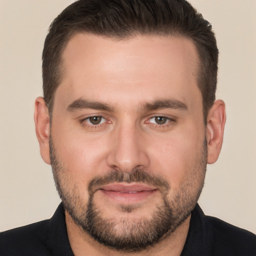 Joyful white young-adult male with short  brown hair and brown eyes