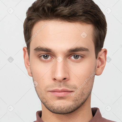 Neutral white young-adult male with short  brown hair and brown eyes