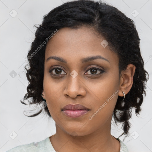 Joyful black young-adult female with medium  brown hair and brown eyes