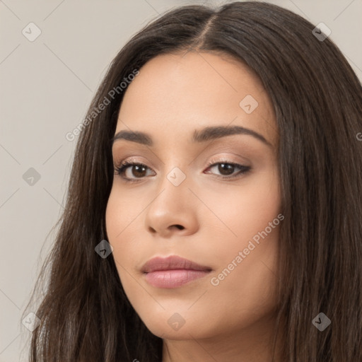 Neutral white young-adult female with long  brown hair and brown eyes