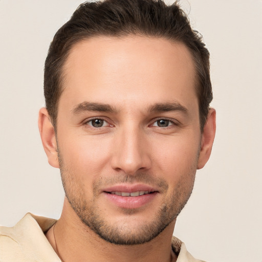 Joyful white young-adult male with short  brown hair and brown eyes