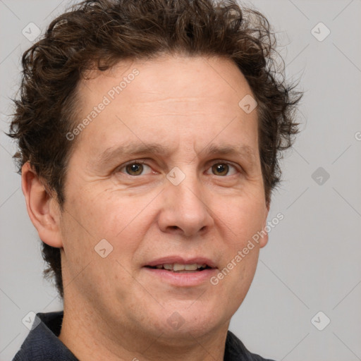 Joyful white adult male with short  brown hair and grey eyes