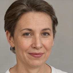 Joyful white adult female with short  brown hair and brown eyes