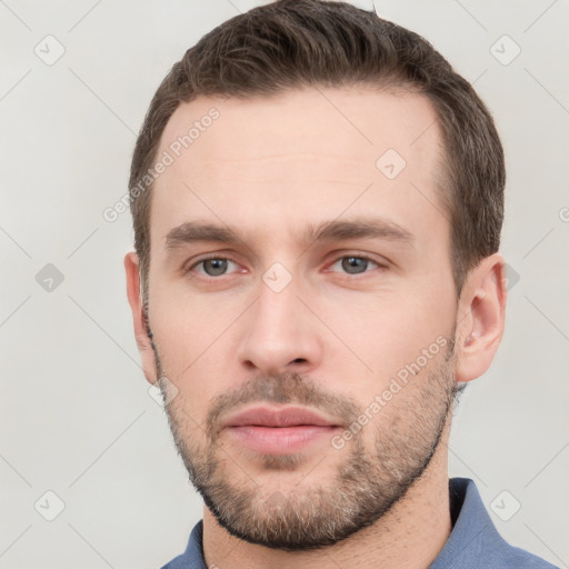 Neutral white young-adult male with short  brown hair and grey eyes