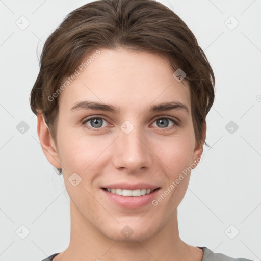 Joyful white young-adult female with short  brown hair and grey eyes