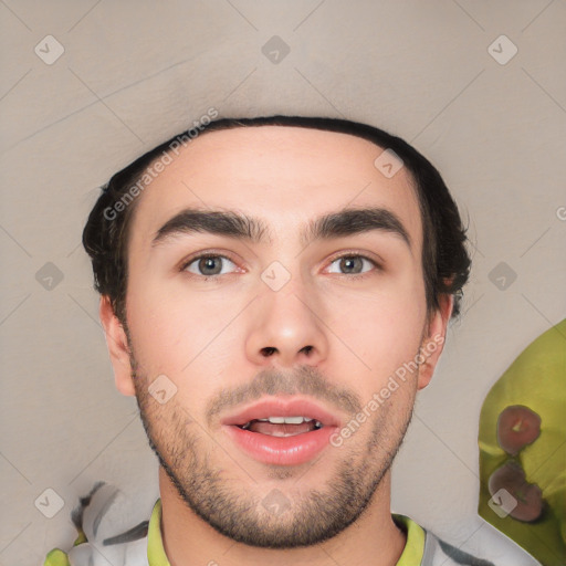 Joyful white young-adult male with short  black hair and brown eyes